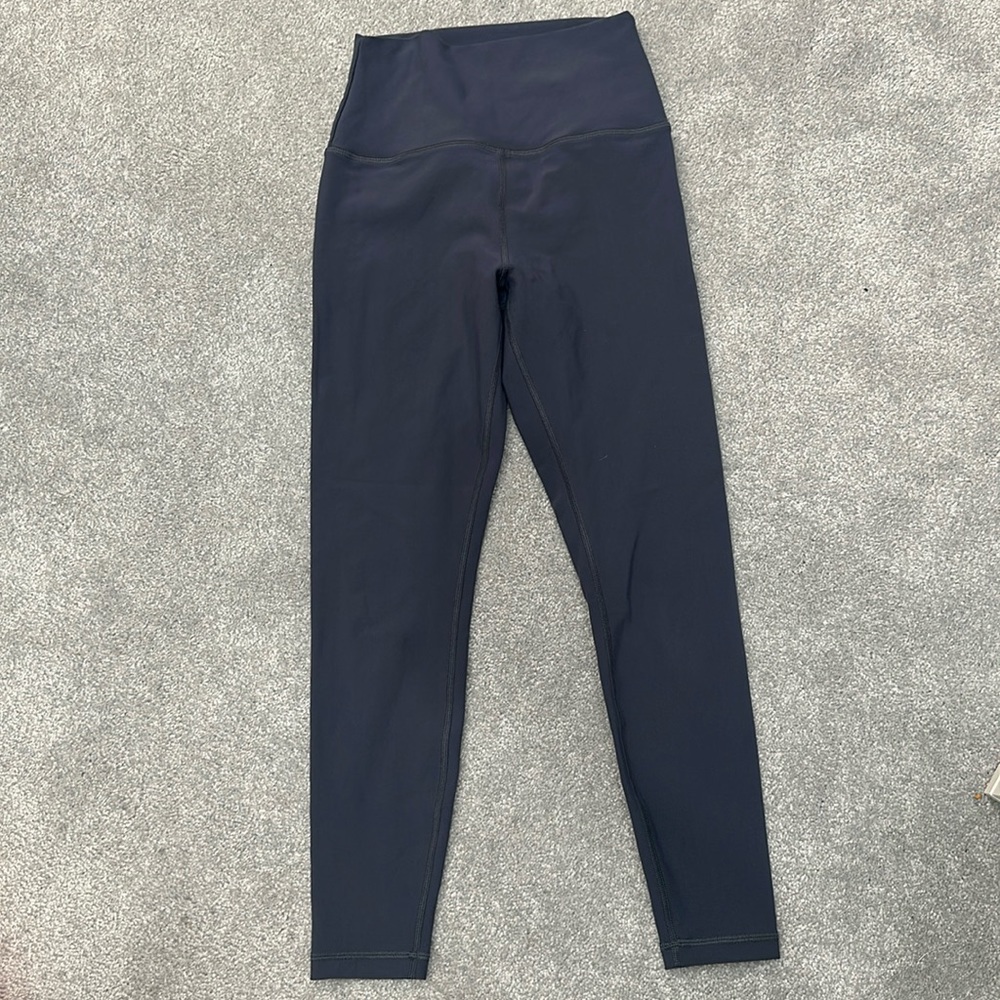 Peloton gray leggings. Peloton logo on back of leg. Size small.